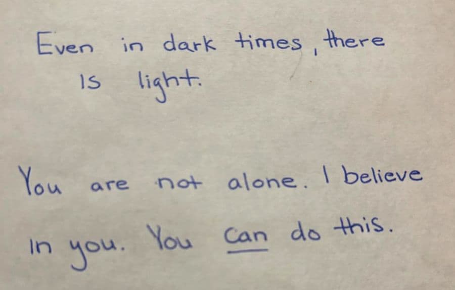 A handwritten note reading: Even in dark times, there is light. You are not alone. I believe in you. You can do this.